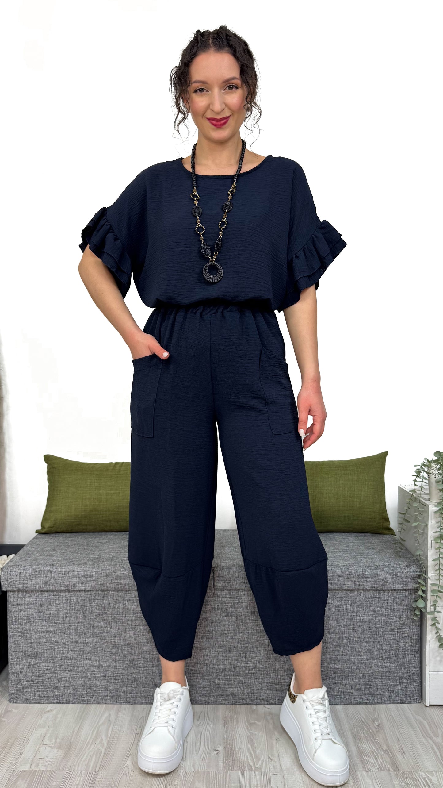 PANTALONE MAMBO con taglio obliquo sulla caviglia