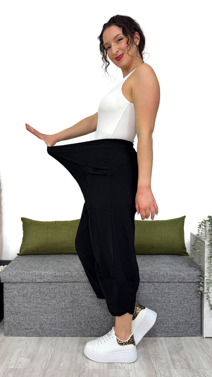 PANTALONE MAMBO con taglio obliquo sulla caviglia