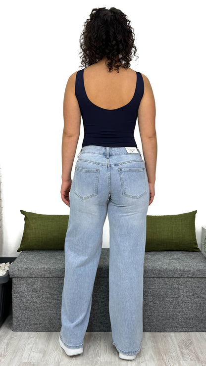 JEANS A ZAMPA CON VITA BASSA