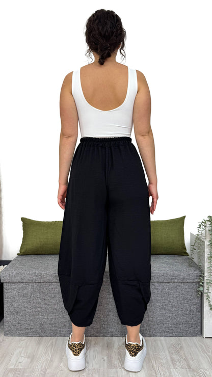 PANTALONE MAMBO con taglio obliquo sulla caviglia
