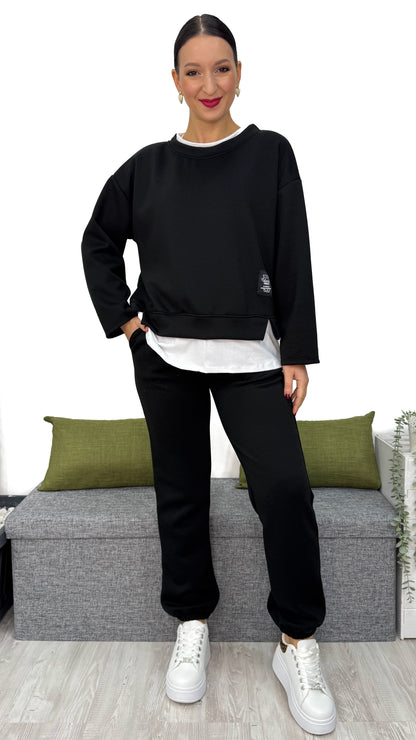 TUTA FELPATA CON BORDINO